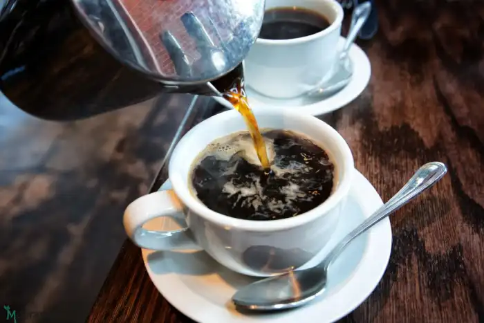 coffee-being-poured-in-a-cup